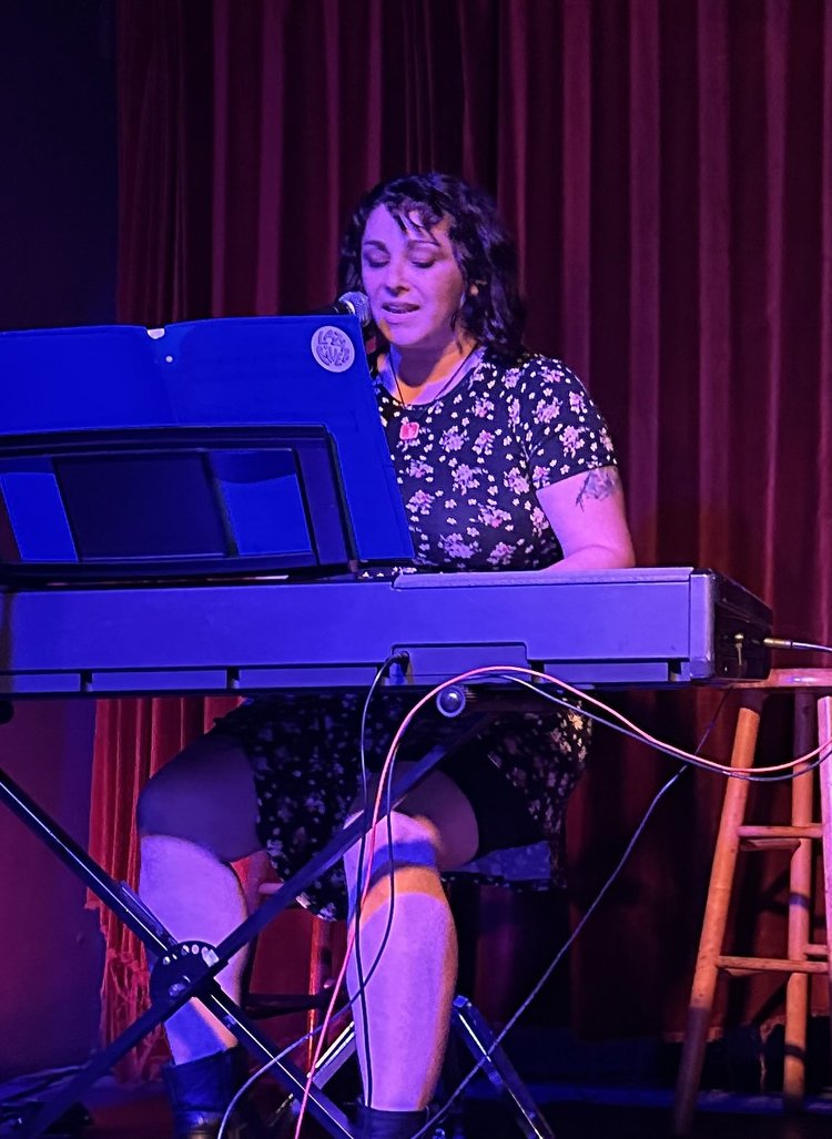 Laura performing at the keyboard